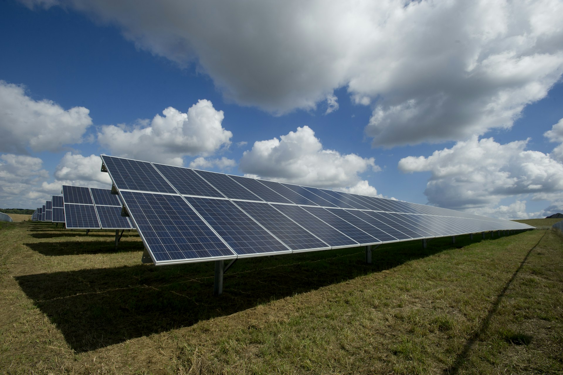Utility-scale solar farm under a clear sky